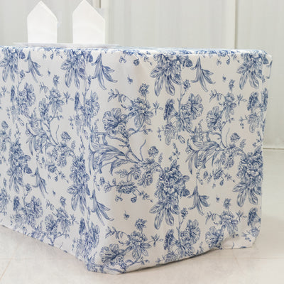 Floral-patterned tablecloth draped over a table in a bright setting.