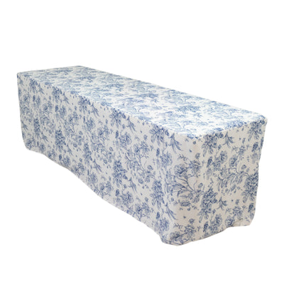 Blue floral tablecloth on a long table.