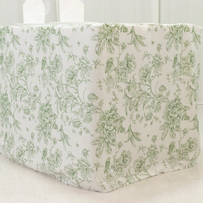 Floral-patterned tablecloth in green and white on a table.