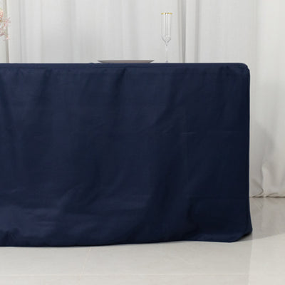 Navy tablecloth draped elegantly over a table in a minimalist setting.