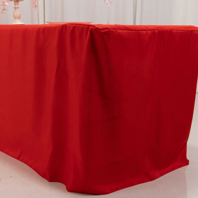 Red tablecloth draping elegantly over a table in a festive setting.