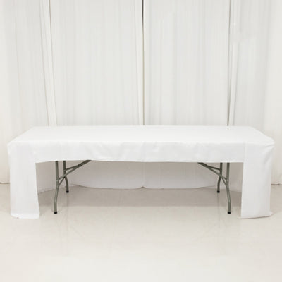 White folding table with a draped tablecloth