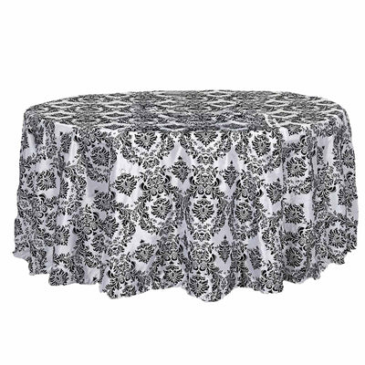 Black and white damask tablecloth for elegant dining settings.