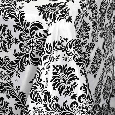 Black and white damask patterned fabric draped elegantly.
