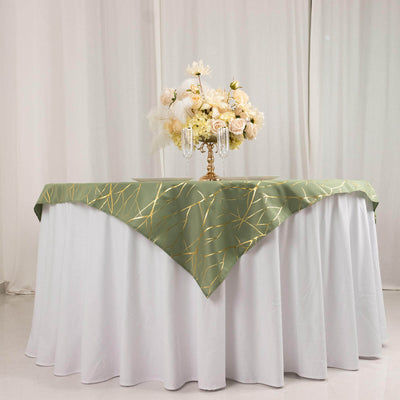 Elegant green tablecloth with gold accents draped over a white table.