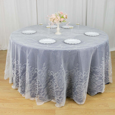 Round gray lace tablecloth draped elegantly over a round table.
