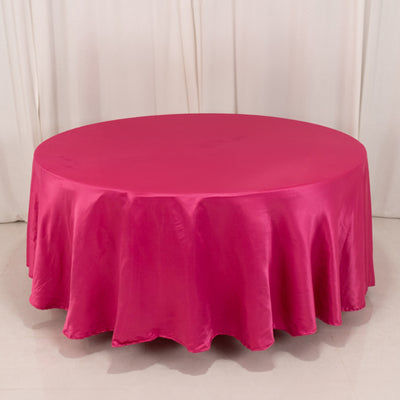 Round pink tablecloth on a round table.