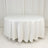 White round table covered with a smooth tablecloth