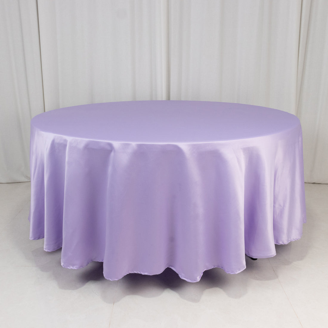 Round lavender tablecloth with elegant draping.