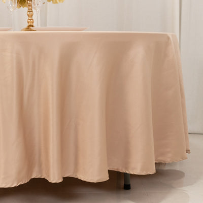 Beige tablecloth draped elegantly over a round table.