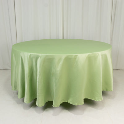 Round green tablecloth on a plain white backdrop