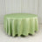 Round green tablecloth on a plain white backdrop