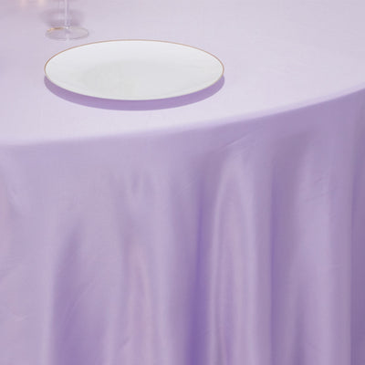 Lavender tablecloth with a white plate on top