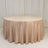 Round beige tablecloth draping elegantly over a circular table.