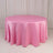 Pink round tablecloth draped elegantly over a table