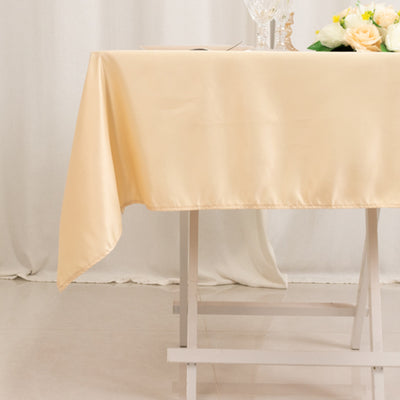 Elegant cream tablecloth draping over a table in a stylish setting.