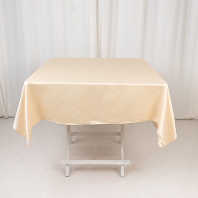 Cream tablecloth draped over a folding table