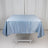 Blue satin tablecloth draped over a white table.