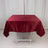 Red satin tablecloth on a plain white backdrop