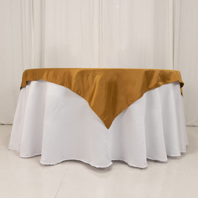 Brown satin tablecloth draped elegantly over a white table.