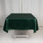 Green satin tablecloth on a white backdrop