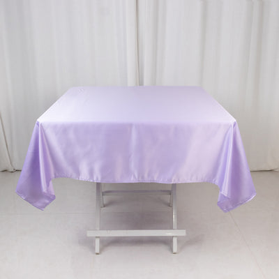 Lavender satin tablecloth draped over a folding table