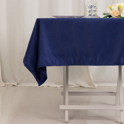 Navy tablecloth draped over a table with elegant decor