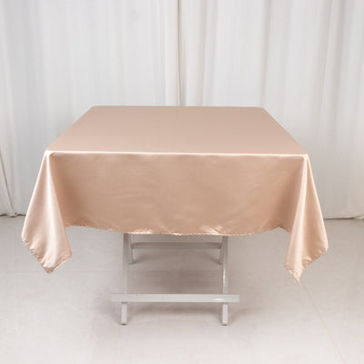 Beige satin tablecloth draped over a table.