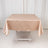 Beige satin tablecloth draped over a table.