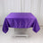 Purple satin tablecloth on a folding table in a studio setting.