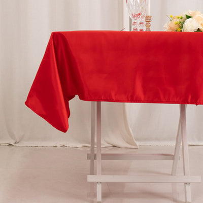 Red satin tablecloth draped elegantly over a table.