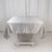 Silver satin tablecloth draped over a white table