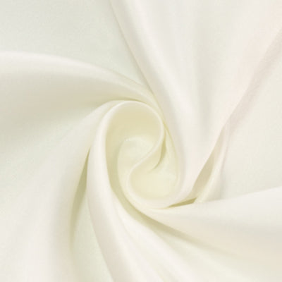 Smooth white fabric swirl texture close-up for textile applications.