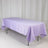 Purple tablecloth draped over a folding table on a white background.
