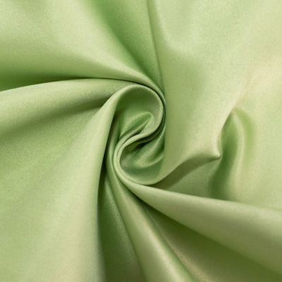 Soft green satin fabric with a smooth texture, elegantly twisted.