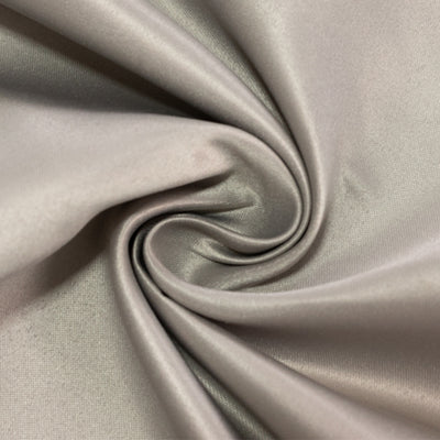 Silky gray fabric swirl showcasing smooth texture and sheen.