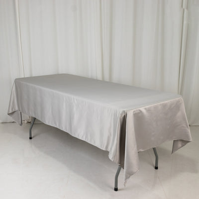 Sleek gray tablecloth draped over a rectangular table.
