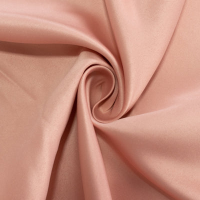 Soft pink satin fabric with a smooth texture and elegant drape.