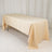 Beige tablecloth draped over a folding table in a studio setting.