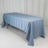 Blue tablecloth draped over a folding table in a studio setting.