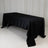Black satin tablecloth draped over a folding table.