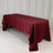 Burgundy tablecloth draped elegantly over a table