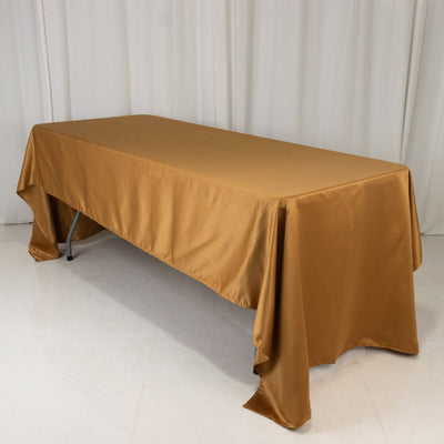 Bronze satin tablecloth draped over a folding table