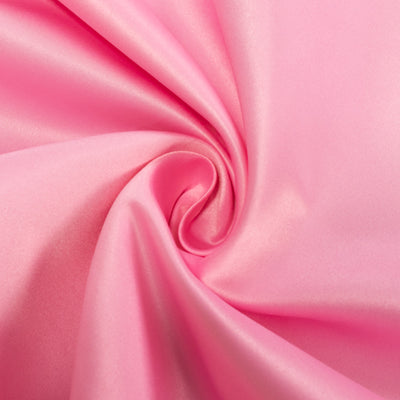 Soft pink satin fabric in a swirling pattern.