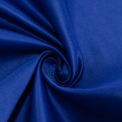 Blue satin fabric texture in a swirling pattern.