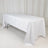 White tablecloth draped over a folding table in a studio setting