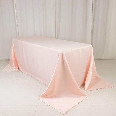Pink tablecloth draped elegantly over a rectangular table