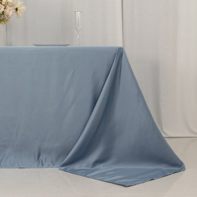 Blue satin tablecloth draped elegantly over a table.