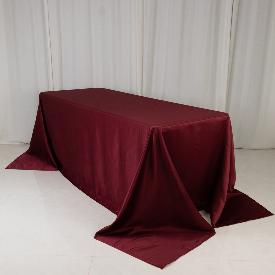 Burgundy tablecloth draped elegantly over a table