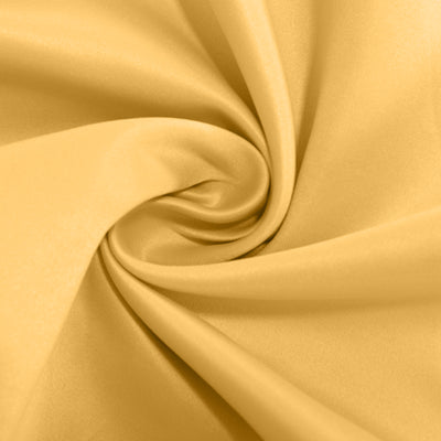 Yellow fabric with a smooth, glossy texture in a spiral pattern.